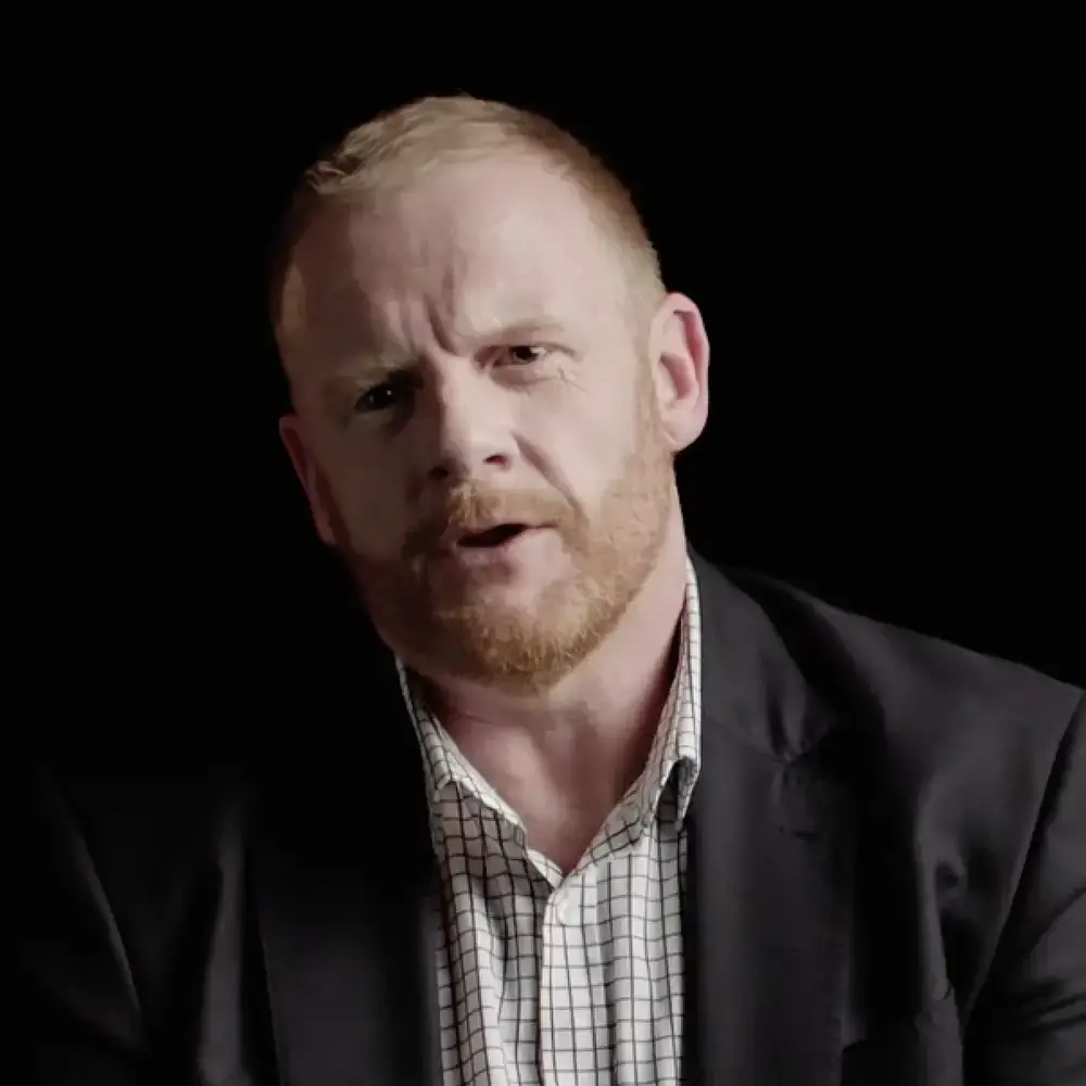 Portrait of Plant for Peace founder and prison leaver, James Brett, speaking to the camera about his story.