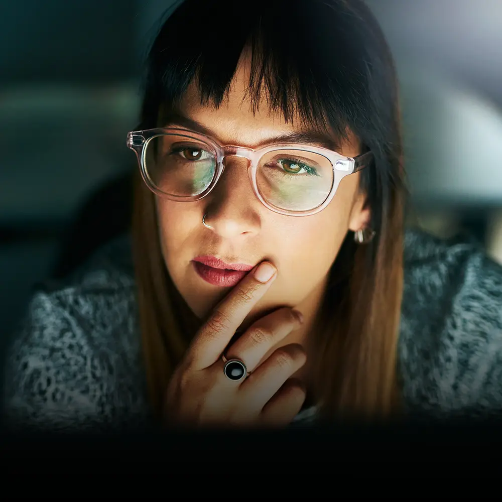 Person looking a laptop screen, participating in a BecomingX corporate development course