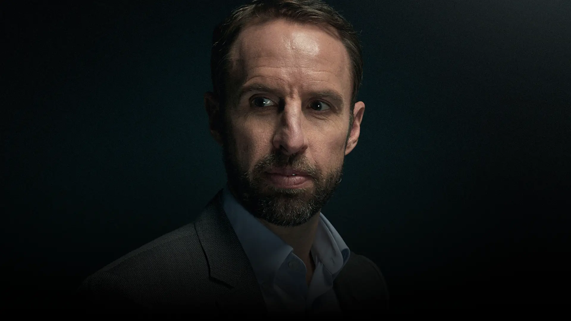 Gareth Southgate looking reflectively past the camera