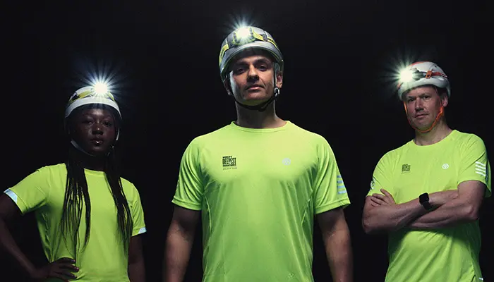Promotional image of three runners in the World's Deepest Marathon