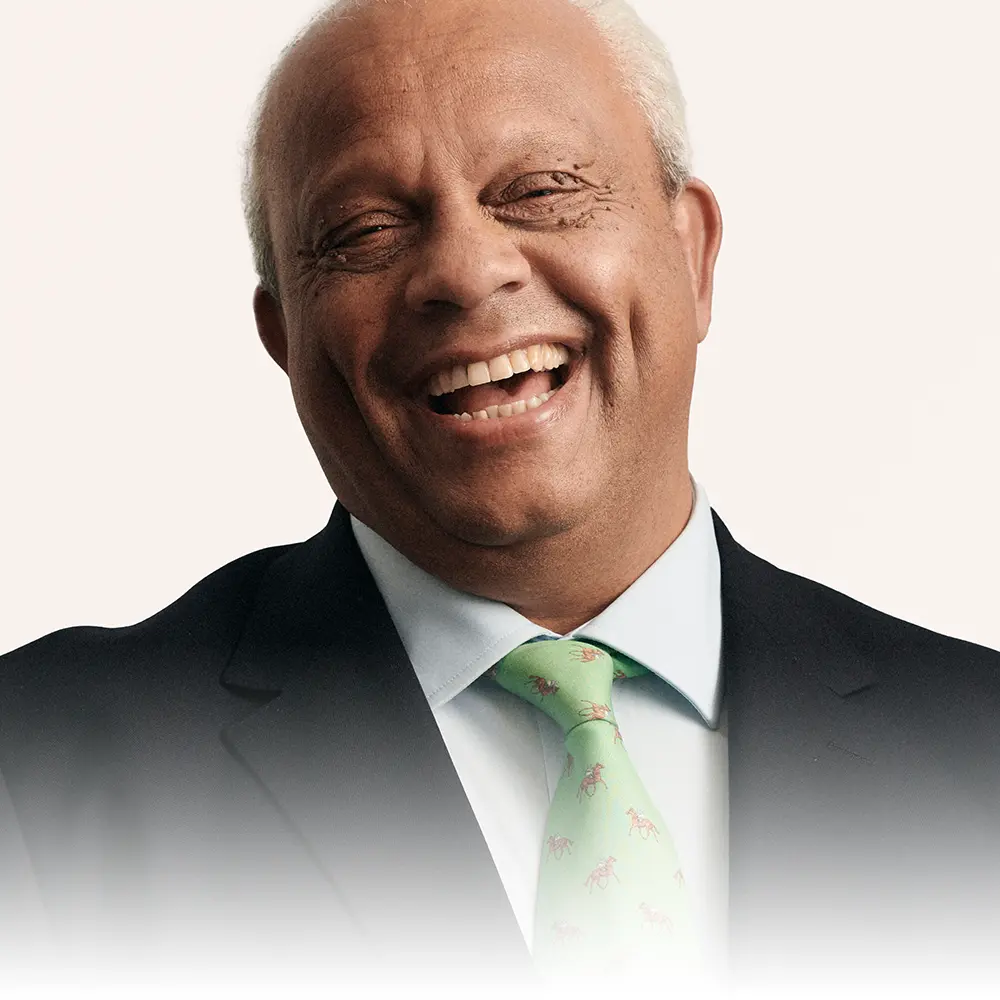 Portrait of Lord Dr Michael Hastings laughing, one of the contributors to The Educators film series with Capita.