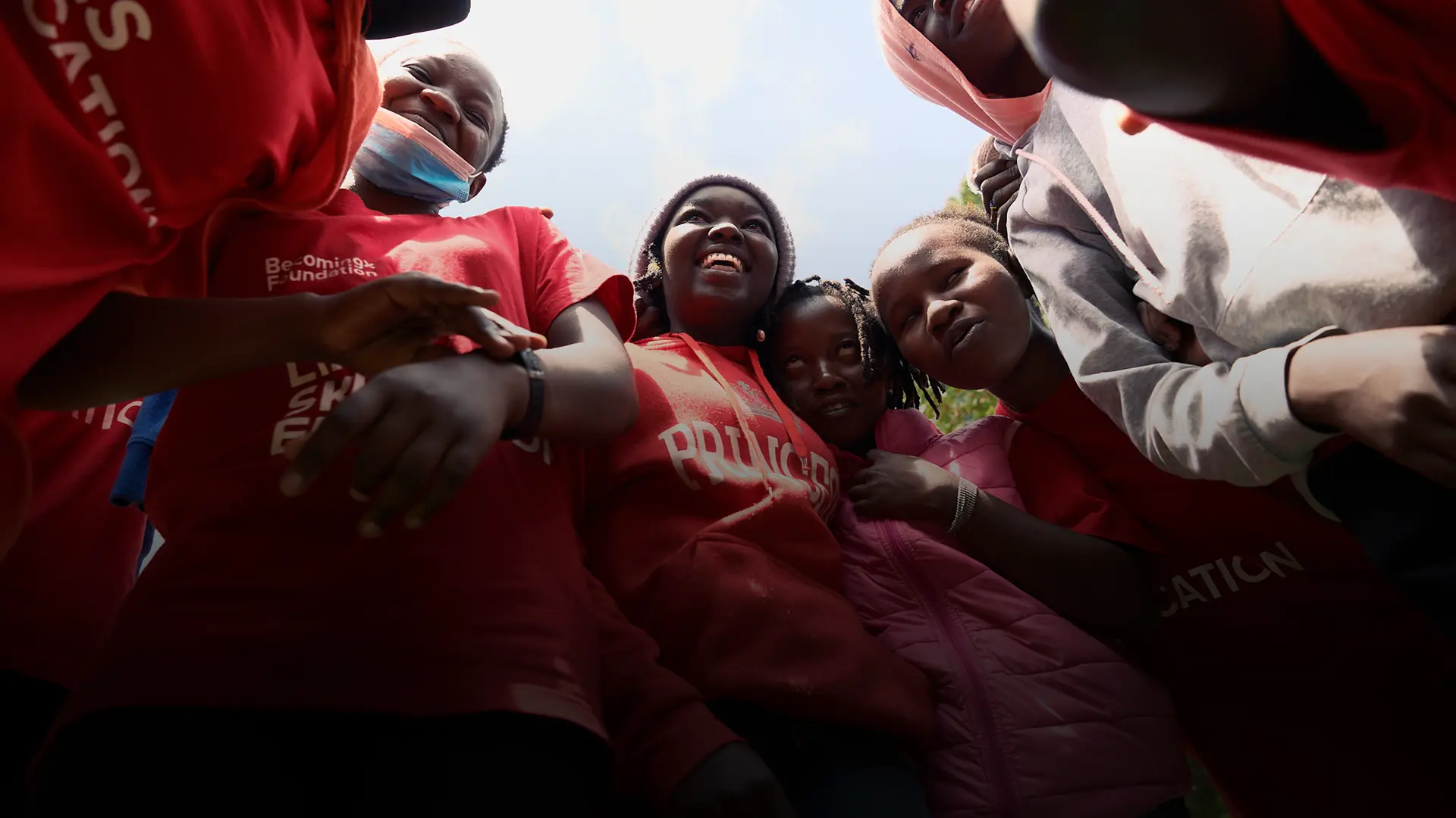 Kenyan children laughing, a photo from the BecomingX Foundation social impact project in Kenya.